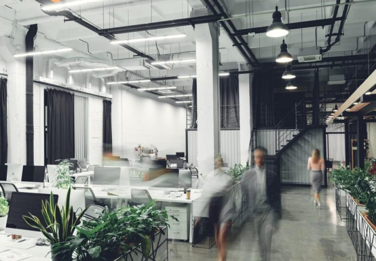 modern office interior with blurred business people in motion